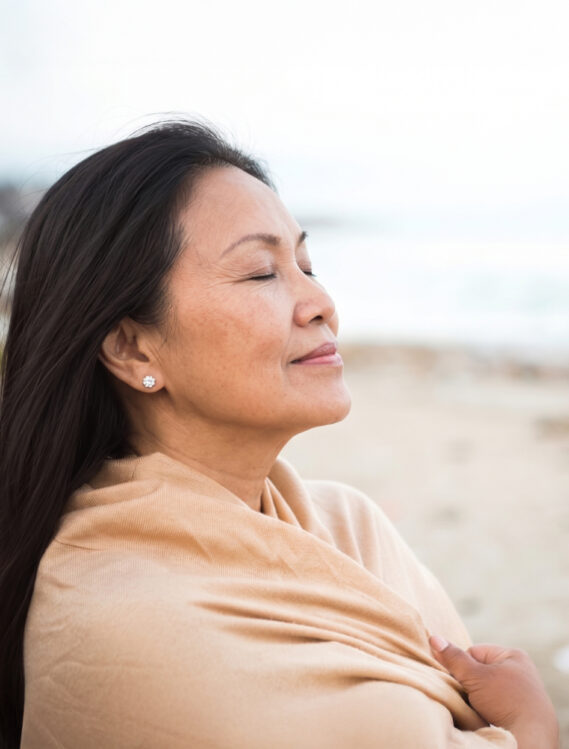 Kelly Lee looking relaxed facing the sea